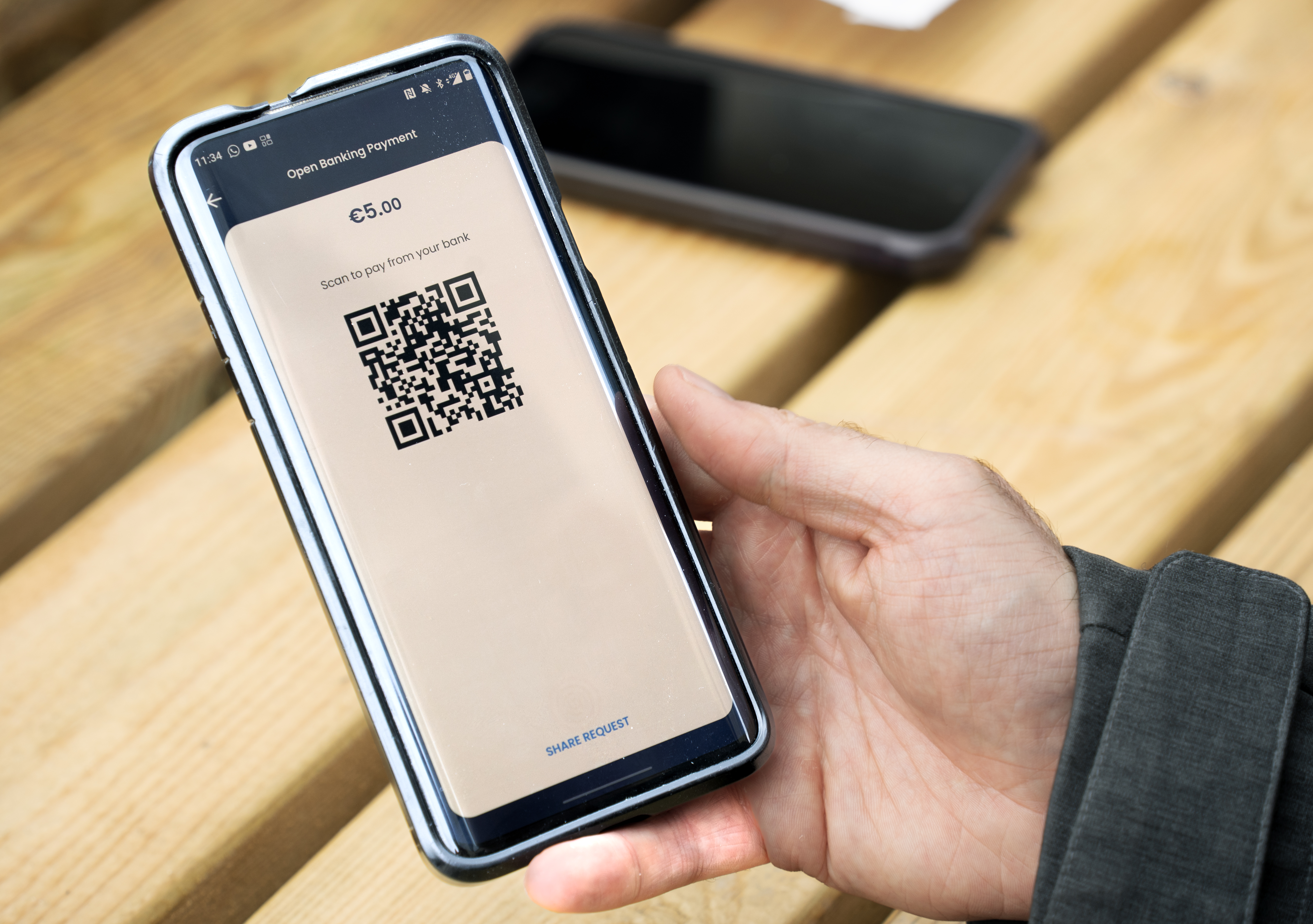 Smartphone screen displaying Fire’s Open Banking payment.